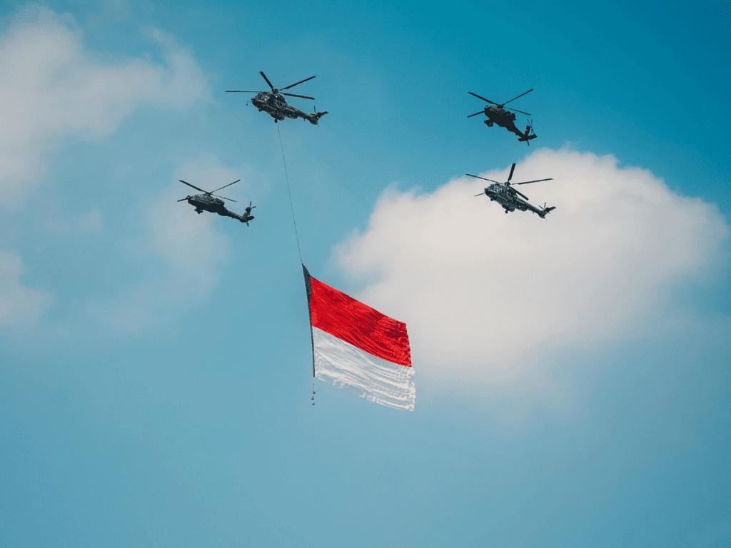 Helicopters fly with a Peruvian flag.