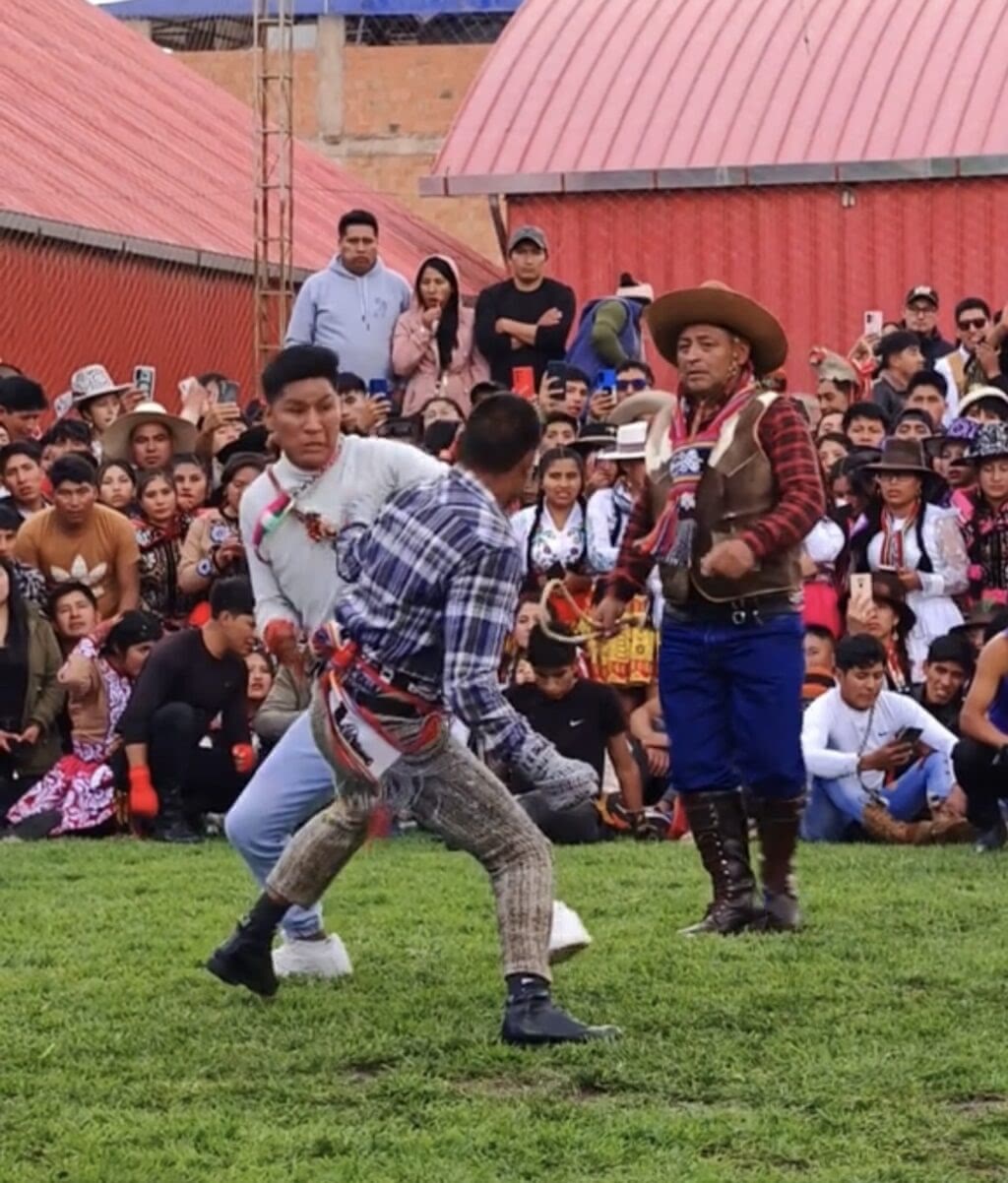 Takanakuy Peru fighting festival. Two men fight.