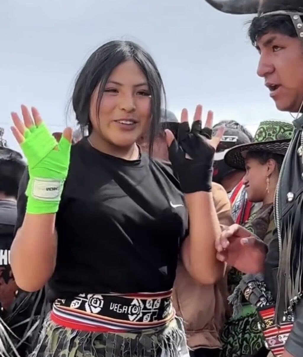 A woman prepares to fight during Takanakuy Peru.