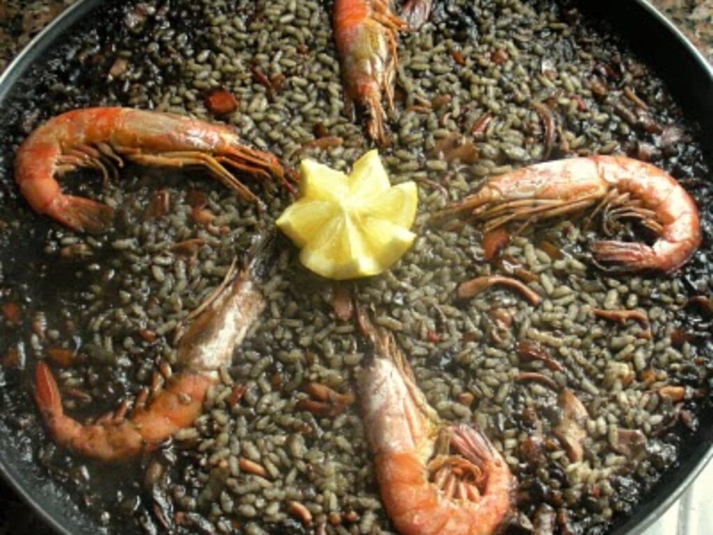 Arroz negro is black because of the squid ink.