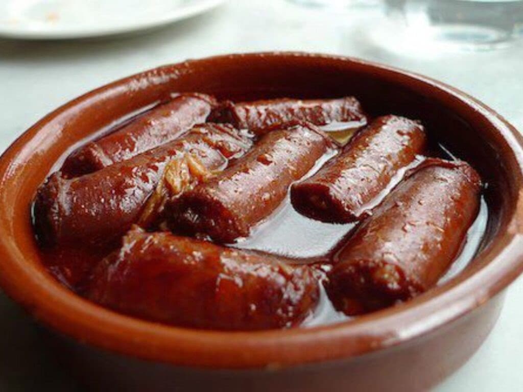 Spanish chorizo simmering in red wine.