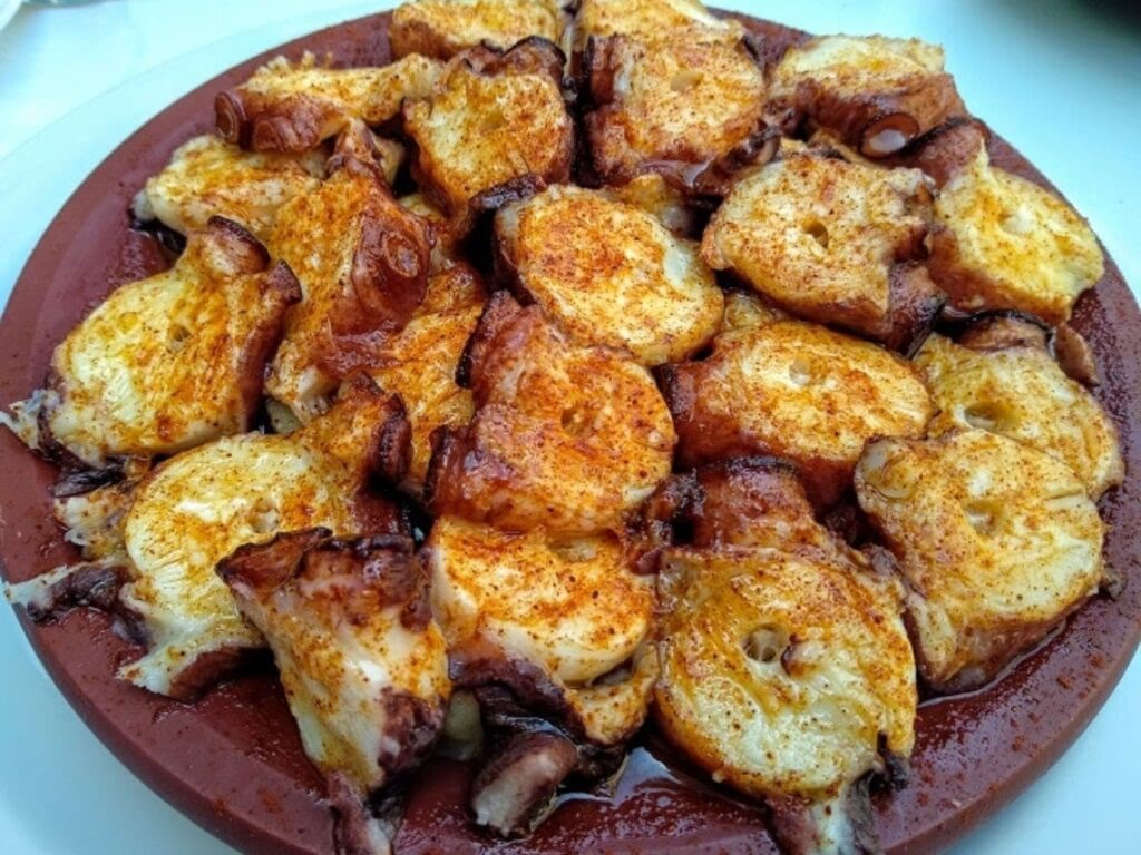 Pulpo a la Gallega, Spanish octopus dish with potatos olive oil and paprika.