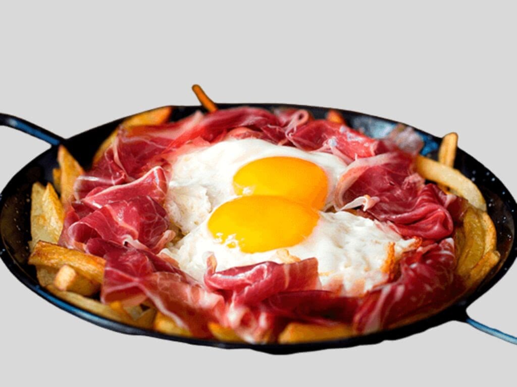A popular dish in Madrid, huevos rotos.